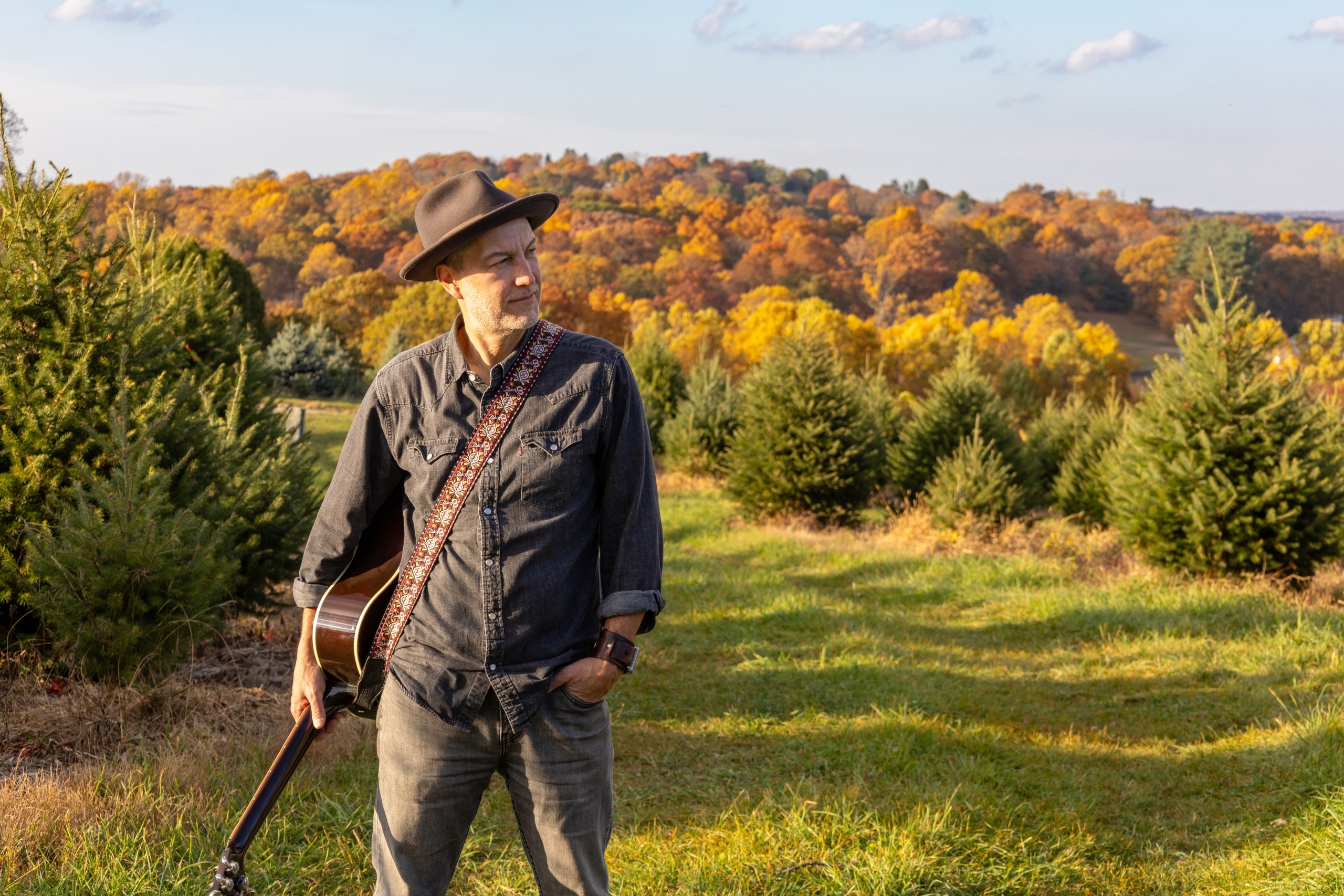 Brian Dolzani with fall foliage at the farm