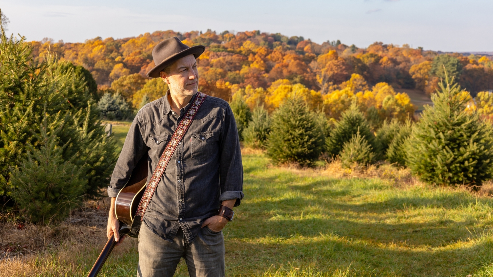 Brian Dolzani with fall foliage at the farm