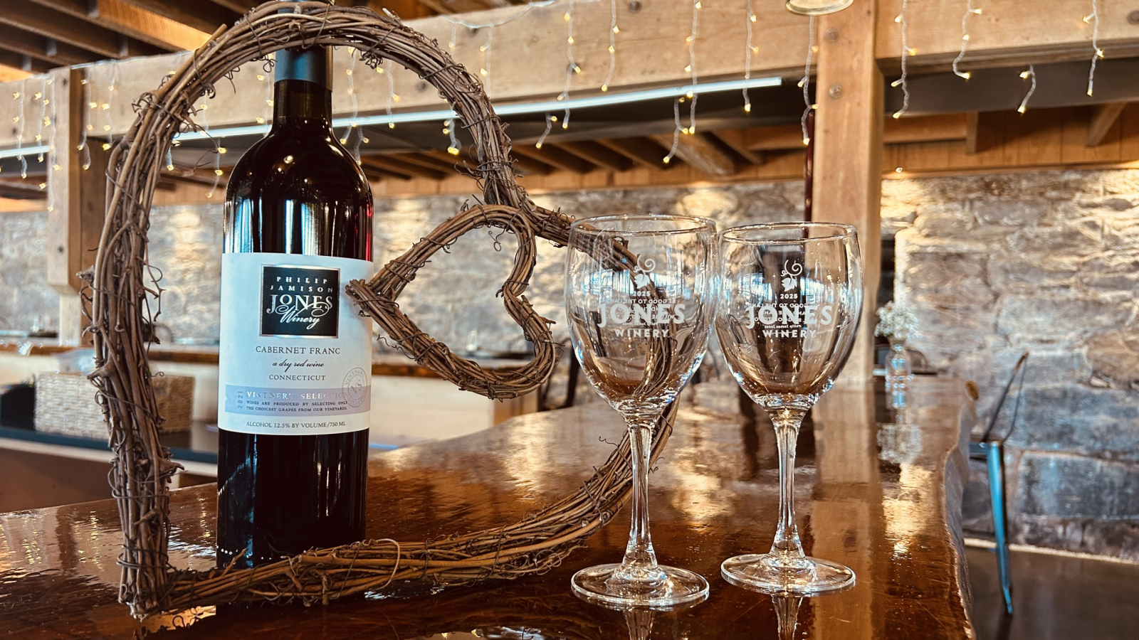 Winery Valentine's Day with wine glasses alongside a heart wreath