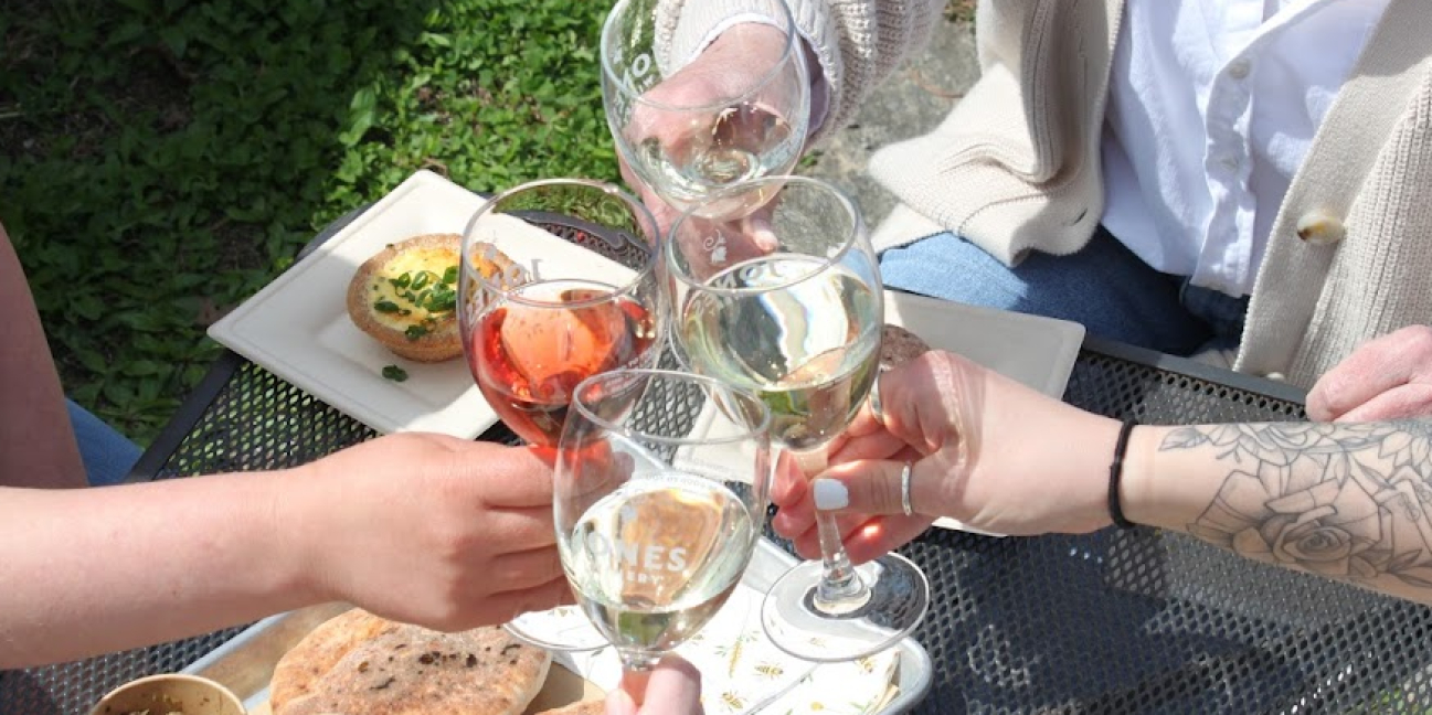 Glasses raised above food 