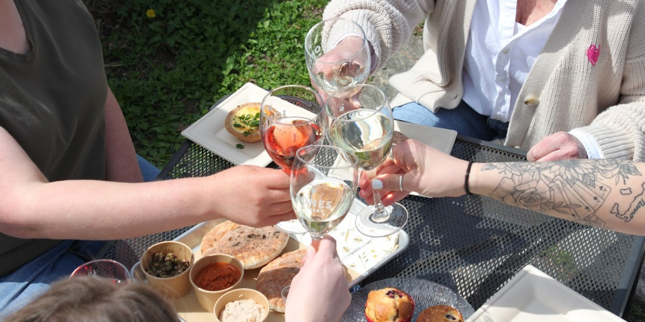 Glasses raised above food 